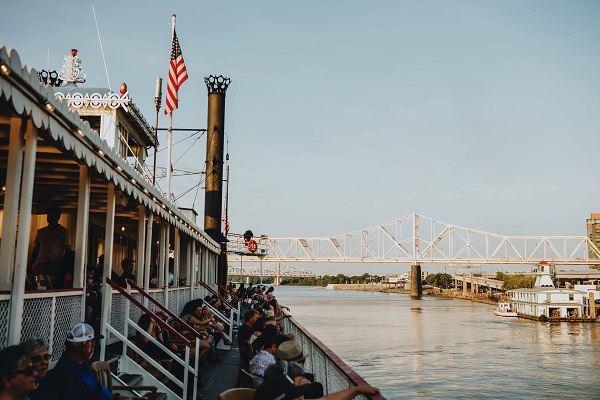 A view of the starboard side of the Hurricane and Texas Deck on the Belle of Louisville during a cruise. In view is the bridge and the Mayor Andrew Broaddus.
