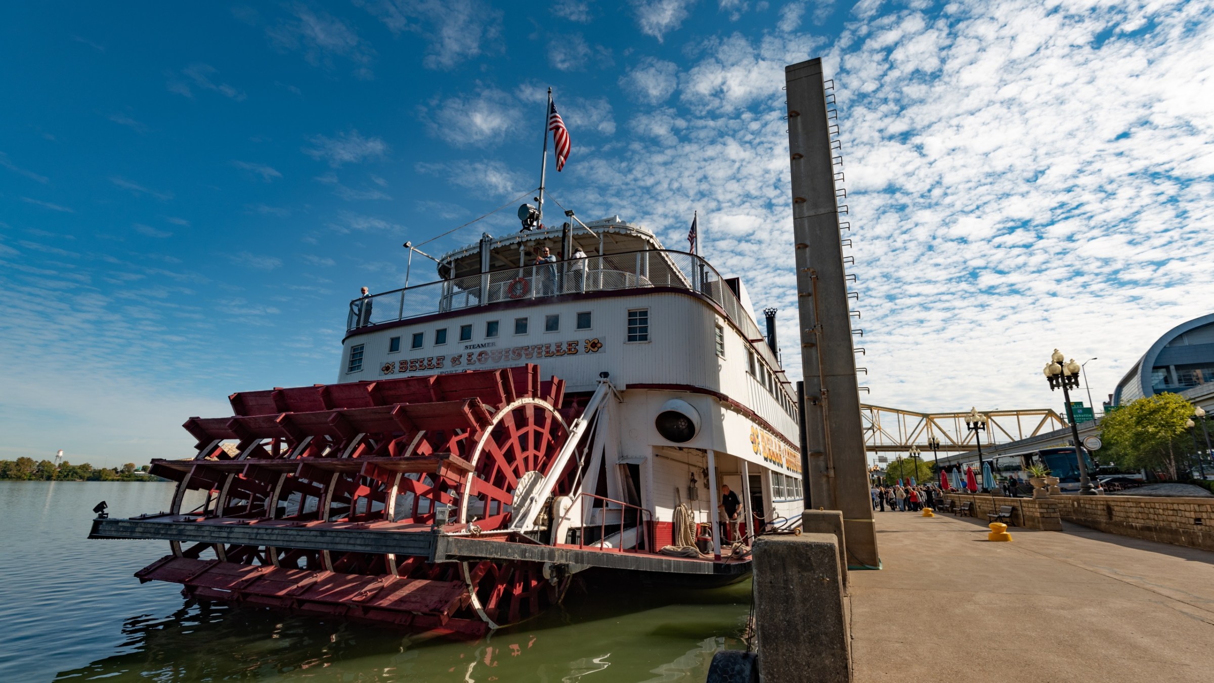 a boat is docked next to a body of water