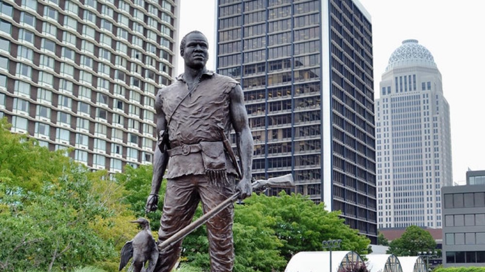 a man standing in front of a building